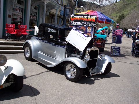 1972 Ford Ranchero - A customized coupe, possibly from the 1930s, displayed outdoors with its hood up.