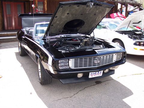 1972 Ford Ranchero - Black 1969 Camaro SS convertible shows its engine bay, with a white car behind it.