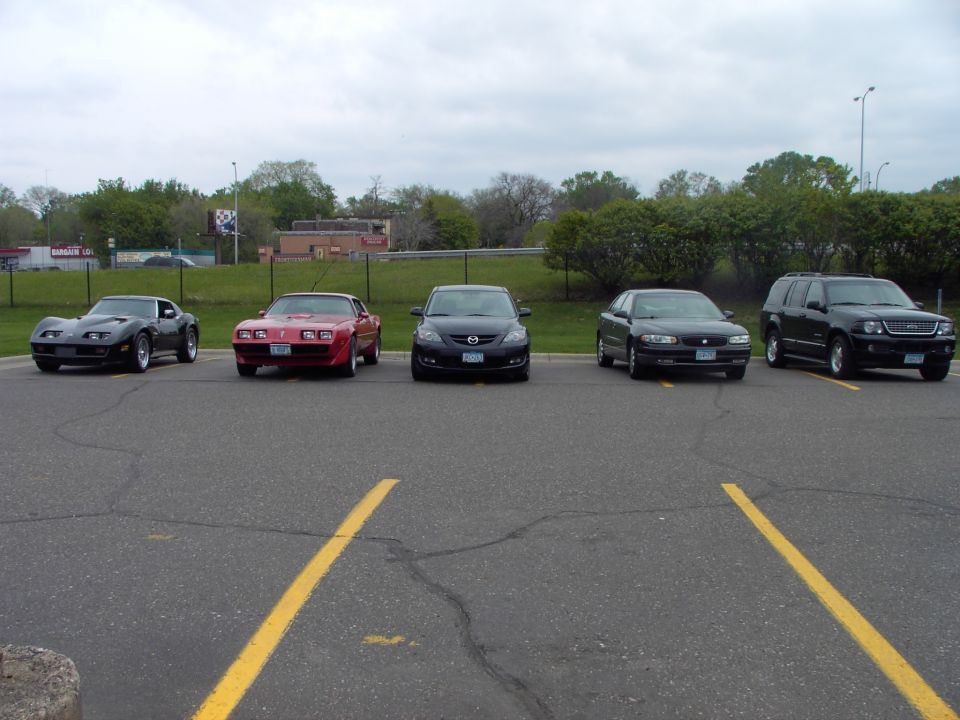 Red 1989 Pontiac Firebird parked in a lot with other cars