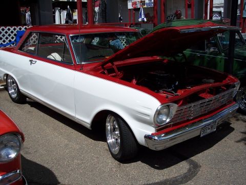 1972 Ford Ranchero - A two-tone classic car is displayed with its engine compartment visible.
