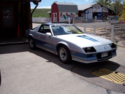 1972 Ford Ranchero - This silver and blue sports coupe features racing stripes and decals on the door, with a license plate from Colorado.