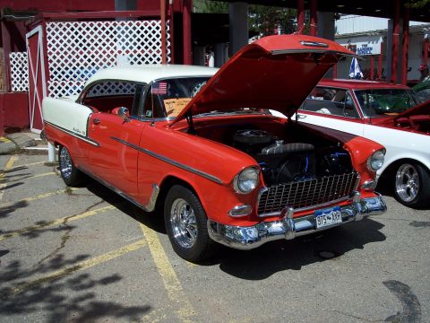 1972 Ford Ranchero - A red and white 1955 Chevrolet Bel Air is displayed with its hood open.
