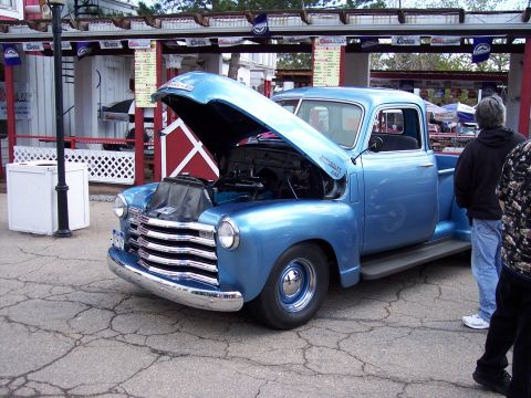 1972 Ford Ranchero - This classic Chevrolet pickup truck is displayed with its hood open, revealing the engine.