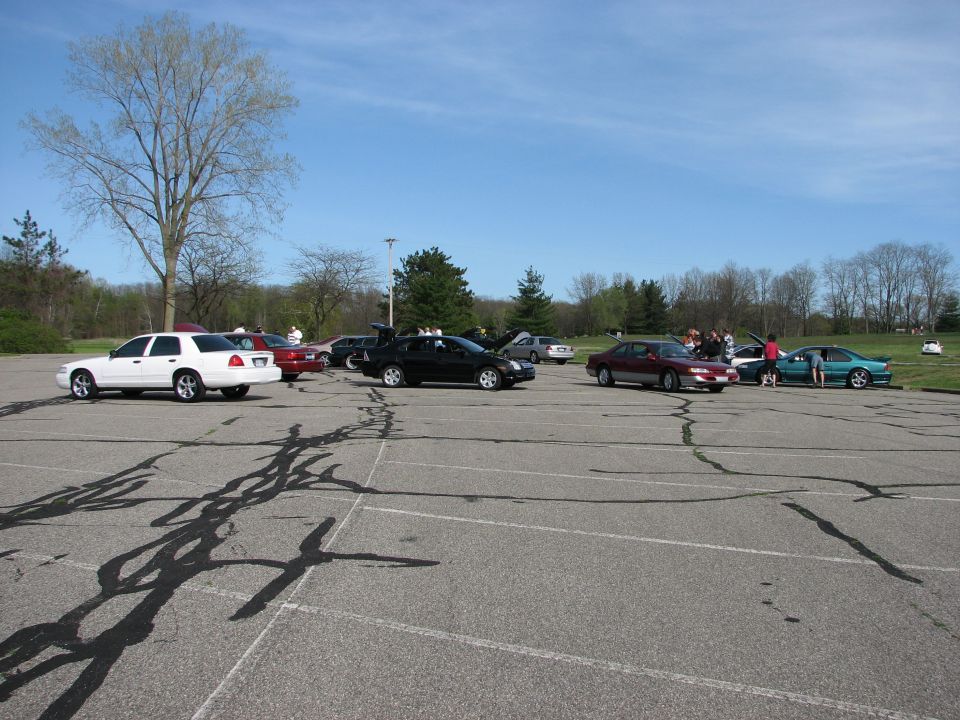 White 2003 Ford Crown Victoria parked in a lot, side view