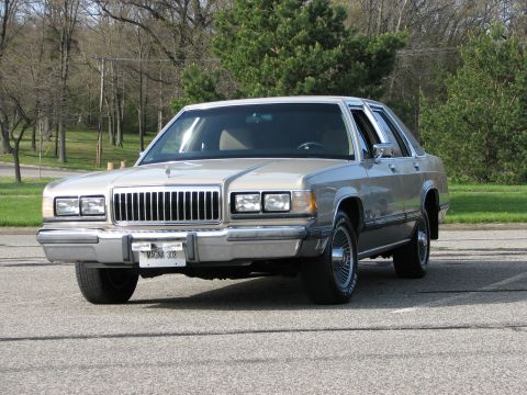 2003 Ford Crown Victoria - This sedan's body style and grille indicate it is from the 1980s, not a 2003 model.