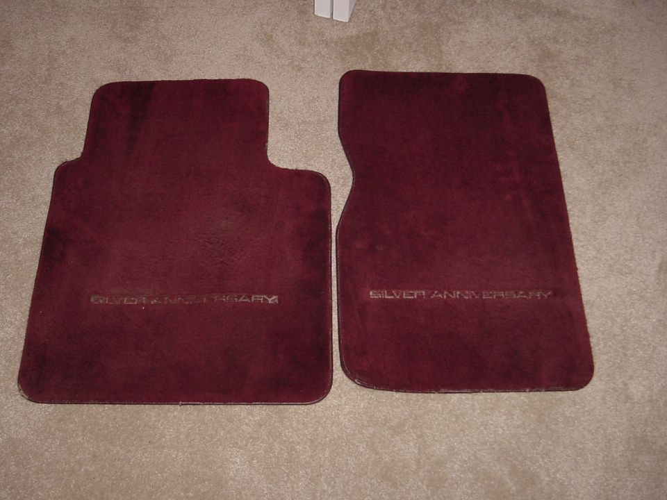 Maroon floor mats with "SILVER ANNIVERSARY" text