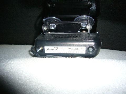2000 Ford Crown Victoria - Close-up of a Whelen Talon siren unit, likely an aftermarket police or emergency vehicle accessory.