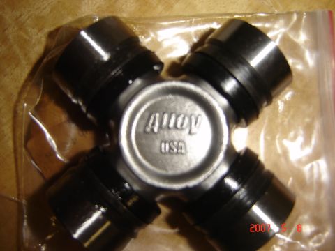 1993 Ford Bronco - Close-up of a universal joint part, with 'Alloy USA' clearly visible on the center housing.