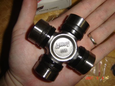 1993 Ford Bronco - Close-up of a universal joint part, labeled 'Alloy USA'.