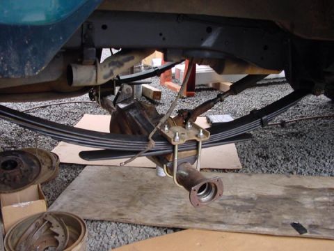 1979 Ford Bronco - Close-up view of a vehicle's rear axle and suspension components during maintenance.