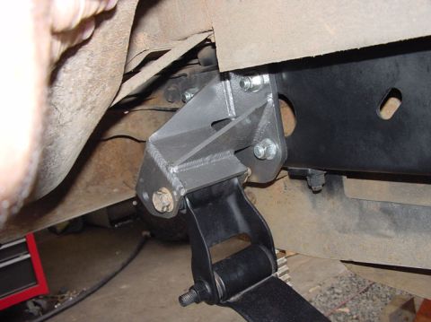 1979 Ford Bronco - Custom suspension bracket installation detail on a vehicle frame.