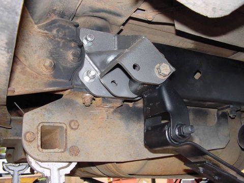 1979 Ford Bronco - Custom suspension bracket installed on the underside of a vehicle, showing new hardware.