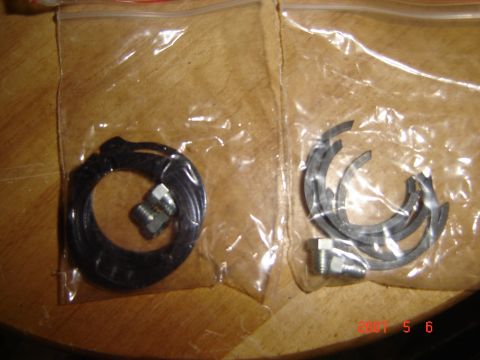 1993 Ford Bronco - New balljoints and u-joints are shown packaged on a wooden surface.