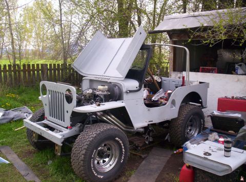 1954 Jeep CJ5 - This 1954 Jeep CJ5 is in the process of restoration, with its hood raised to reveal the engine bay.
