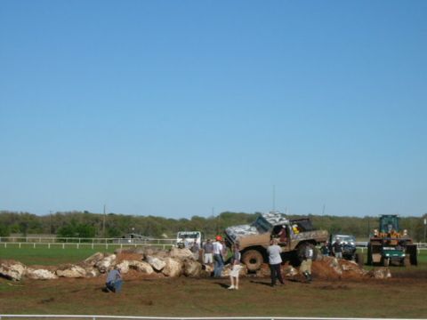 1978 Ford Bronco - A 1978 Ford Bronco navigates a challenging rock obstacle during an off-road event.