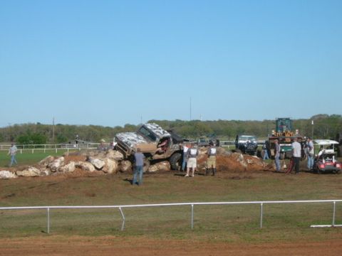 1978 Ford Bronco - A 1978 Ford Bronco navigates a challenging rock course with spectators observing.