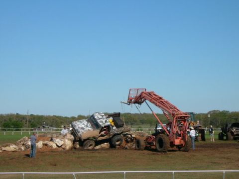 1978 Ford Bronco - A 1978 Ford Bronco attempts to navigate a rocky obstacle course with assistance from a loader.