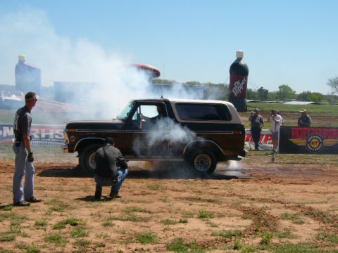 1978 Ford Bronco - A 1978 Ford Bronco performs a burnout, enveloped in a cloud of smoke.