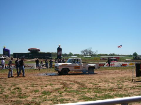 1978 Ford Bronco - 1978 Ford F-150 Stepside performing a burnout at an outdoor event.