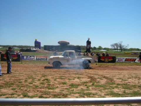 1978 Ford Bronco - A 1978 Ford F-150 pickup truck performs a burnout at an outdoor event.