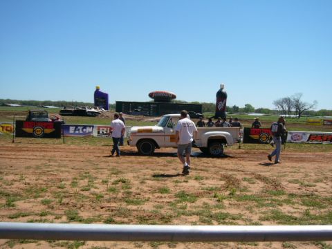 1978 Ford Bronco - A white 1978 Ford F-150 pickup truck is parked at an outdoor event with spectators around.