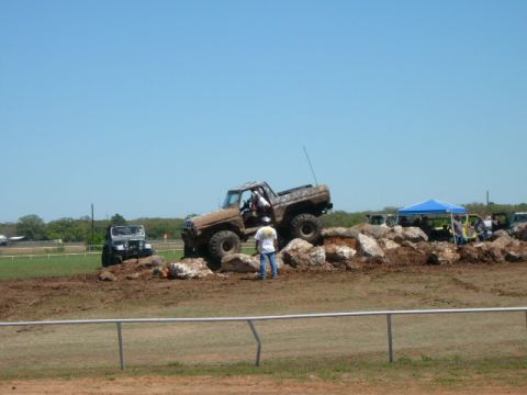 1978 Ford Bronco - A 1978 Ford Bronco navigates a rocky obstacle course during a competition.
