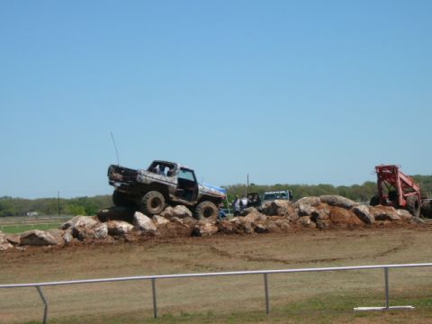 1978 Ford Bronco - A 1978 Ford Bronco navigates a rocky obstacle course on a sunny day.