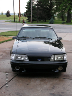 1988 Ford Mustang - Front view of a black 1988 Ford Mustang parked on a driveway.