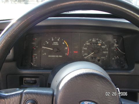 1988 Ford Mustang - The interior of a 1988 Ford Mustang shows the dashboard gauges, including the tachometer and speedometer.