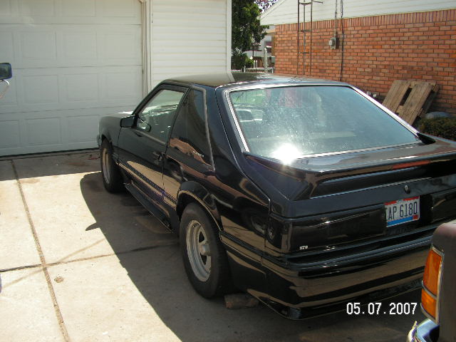 Black 1988 Ford Mustang coupe rear 3/4 view