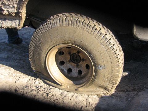 1989 Ford Bronco - My busted tire. Side-wall punctured.