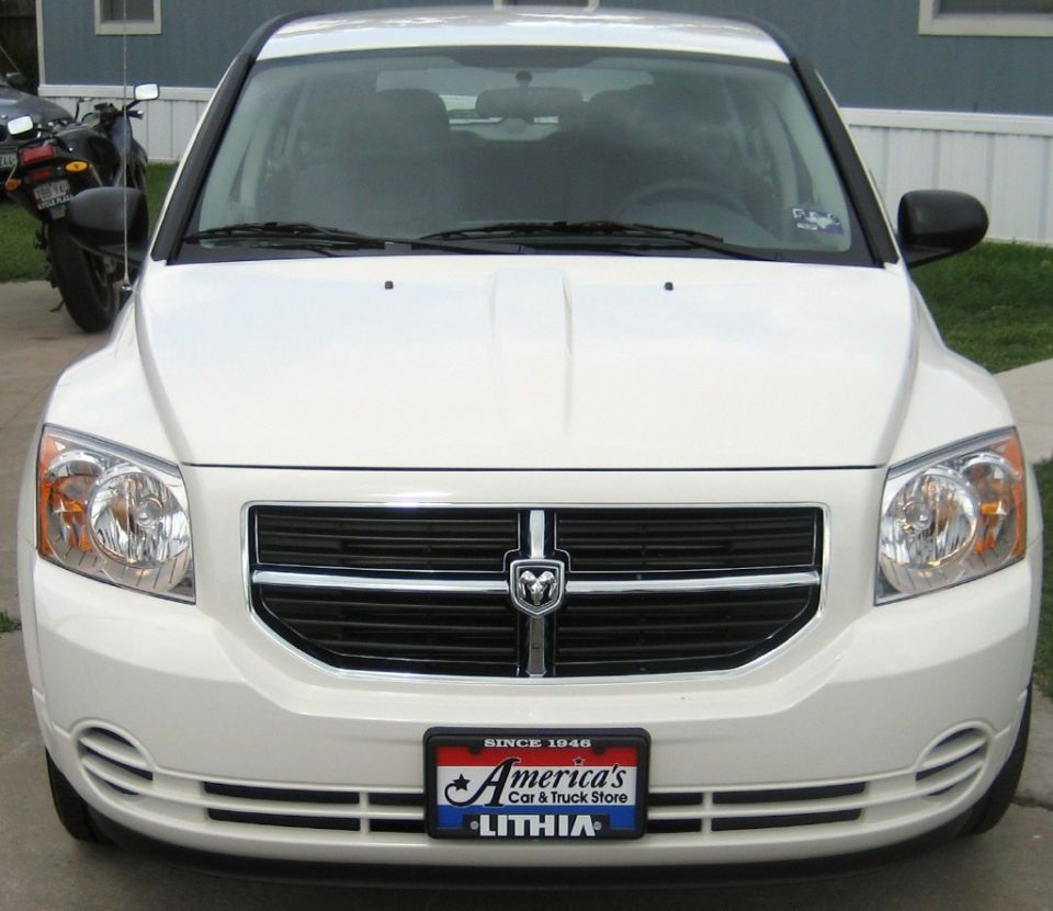 White Dodge Caliber front view with Ram grille badge and Lithia dealer plate