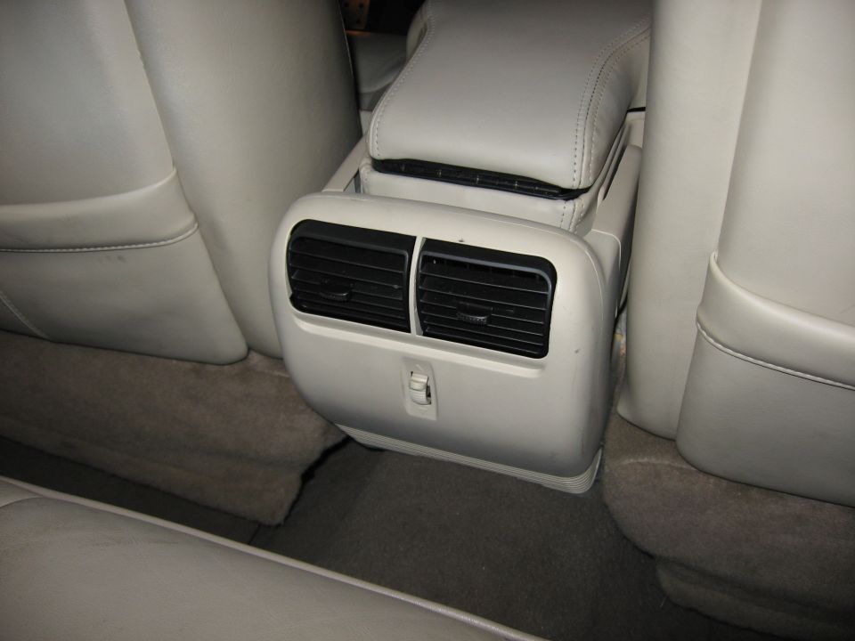 Rear seat air vents and center console in a car