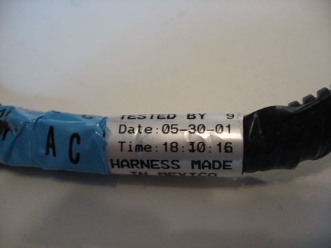 2001 Ford Crown Victoria - A label on a wiring harness indicates it was tested on May 30, 2001.