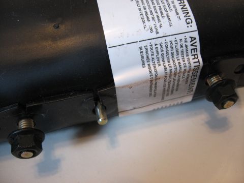 2001 Ford Crown Victoria - Warning label on a black part advises consulting the shop manual for repair and diagnostics, with warnings about alteration and potential i…