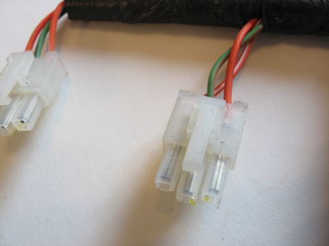2001 Ford Crown Victoria - Close-up view of automotive wiring harness connectors with visible wires and plastic housing.