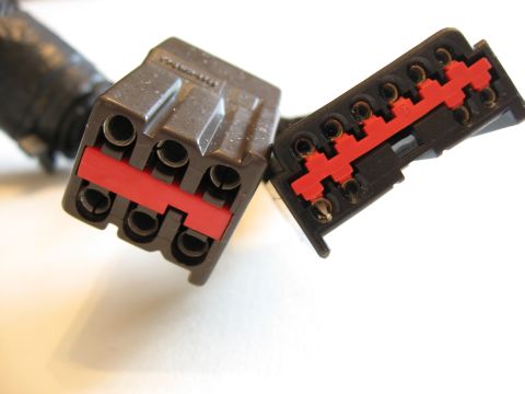 2001 Ford Crown Victoria - Close-up of two electrical connectors, likely for automotive use, showing their pin configuration.