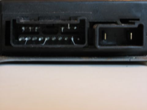 2001 Ford Crown Victoria - Automotive electronic control module connectors with visible pins and white residue.
