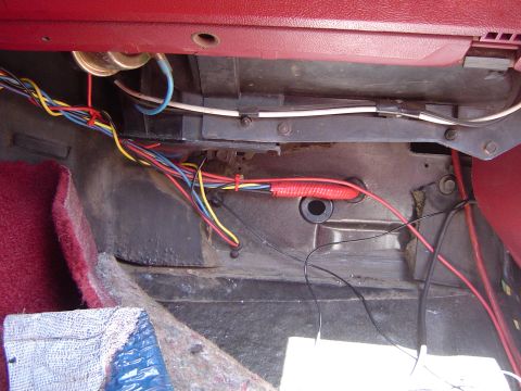1989 Ford Bronco - Wiring harness visible under the dashboard of a vehicle, possibly for an aftermarket installation.