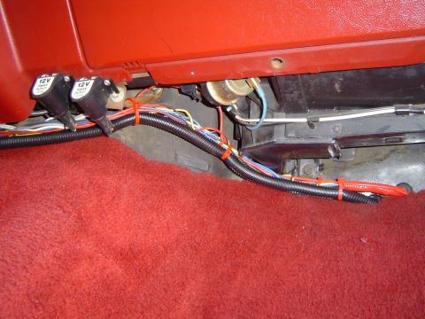 1989 Ford Bronco - Custom wiring and power outlets are visible in the interior of a vehicle.