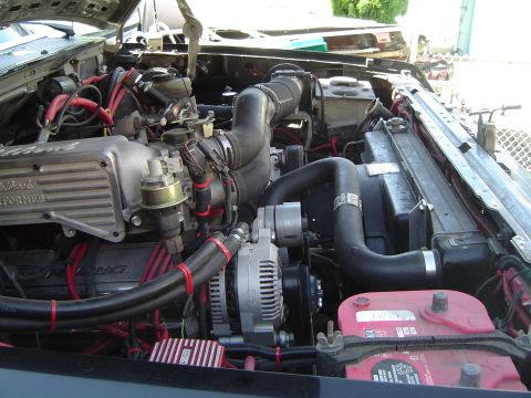 1989 Ford Bronco - Engine bay view shows a Ford V8 with aftermarket valve covers and wiring modifications.