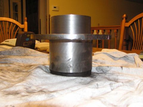 2000 Chevrolet Tahoe - A metal part, possibly a bearing or hub assembly, is shown on a cloth-covered surface.