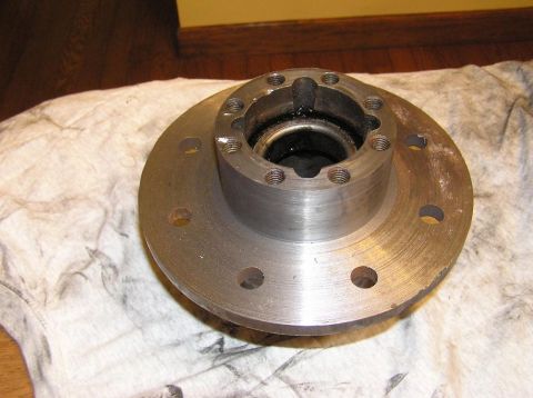 2000 Chevrolet Tahoe - Wheel hub assembly with six bolt holes and a central bearing housing, resting on a cloth.