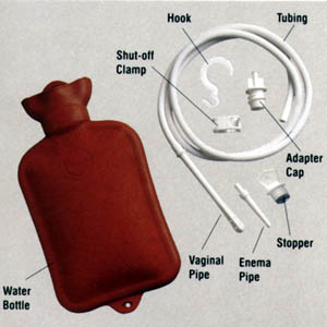 1987 Suzuki Samurai - A collection of medical supplies, including a hot water bottle and enema kit components, are displayed.