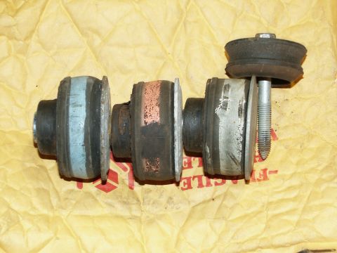 2001 Mercury Grand Marquis - Set of three body mount bushings, one with a blue stripe, another with red, on yellow paper.