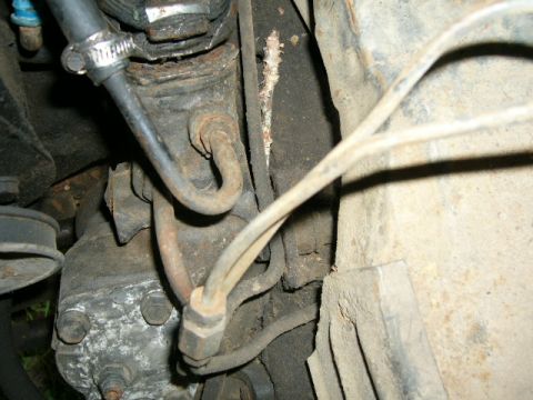 1978 Ford E250 - Underside view of a vehicle's steering box and associated hydraulic lines.