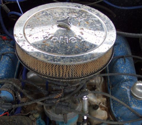 1979 Ford Bronco - Close-up of a Holley air cleaner assembly on an engine.