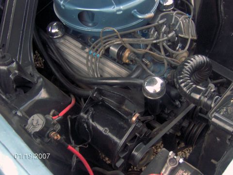 1964 Ford Ranchero - Close-up of a V8 engine bay, including the distributor and spark plug wires. Date stamp visible.