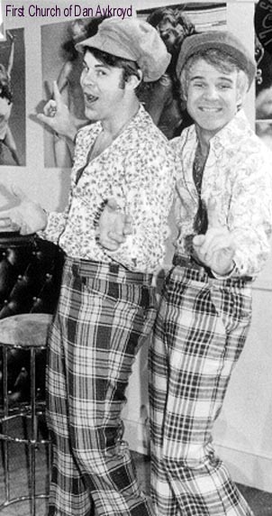 1984 BMW 3 Series - This image shows two men in plaid pants and patterned shirts, with one wearing a cap.