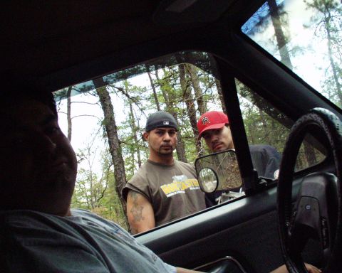 1989 Ford Bronco - Looking out from the driver's seat at two men standing outside the vehicle.